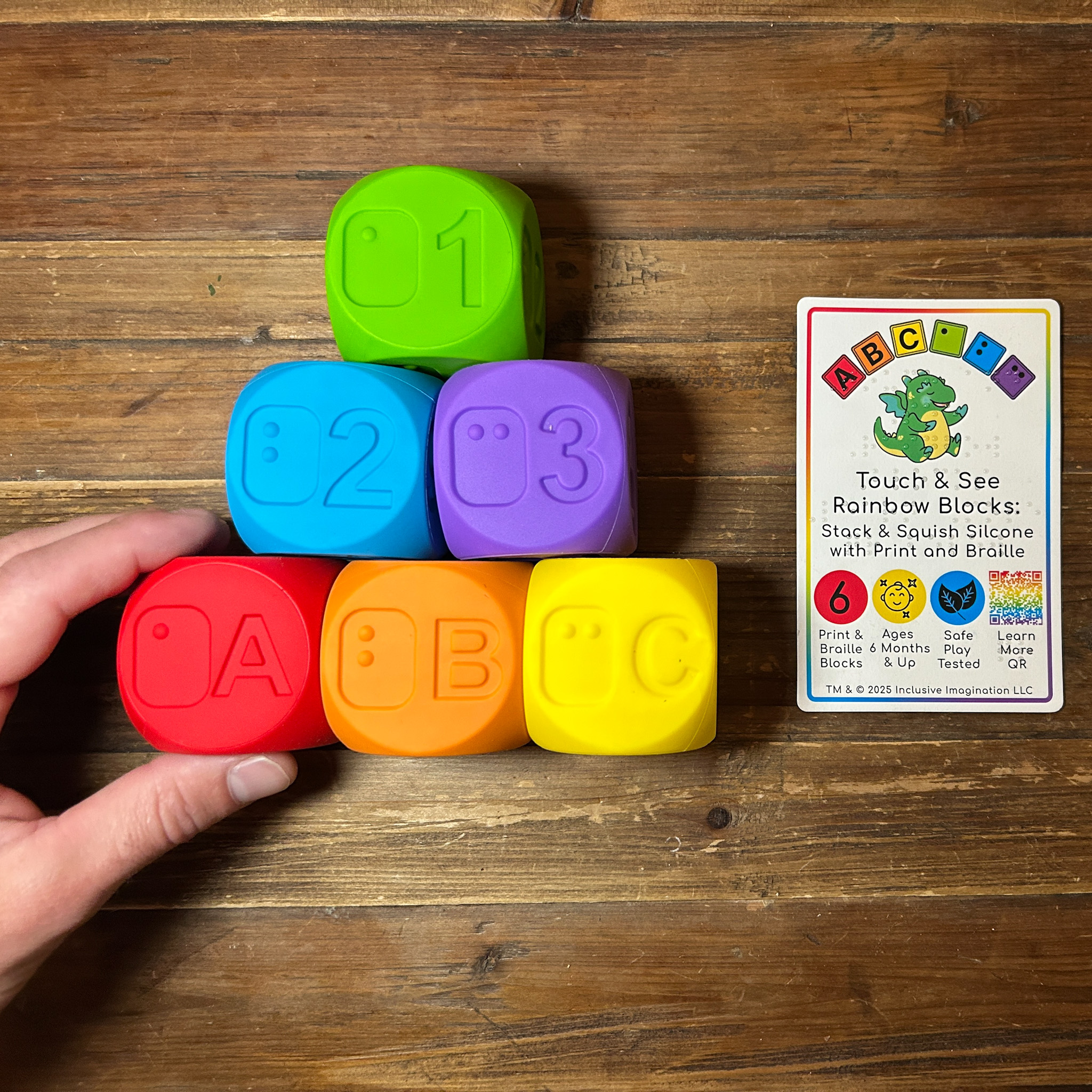 6 rainbow themed, print and braille, silicone blocks showing letters A B C and number 1 2 3